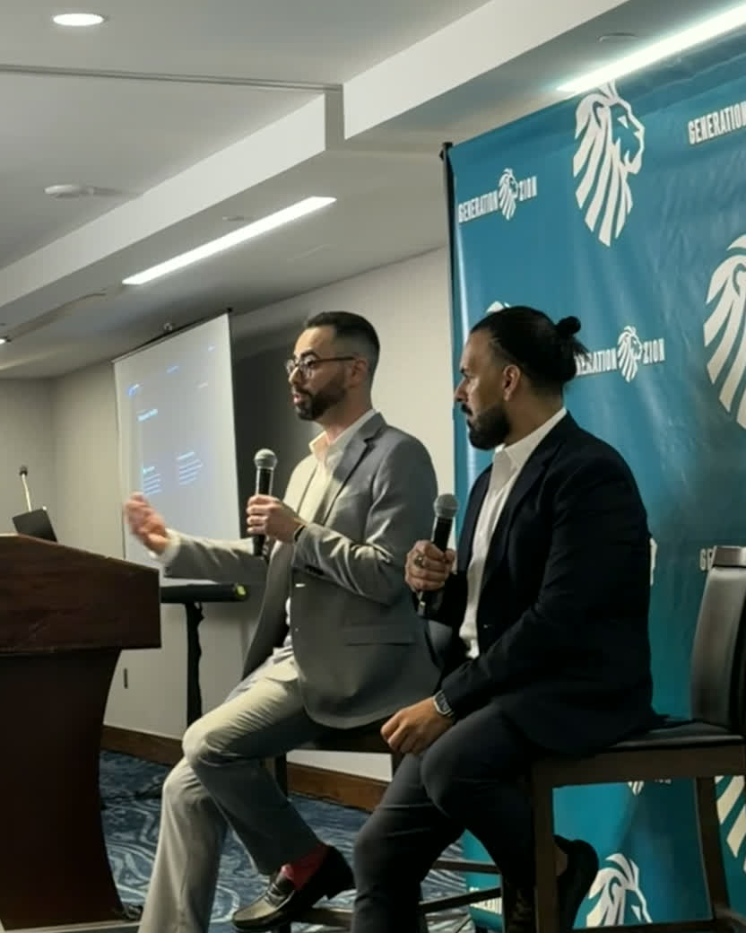 Fabian Garcia and David Khait speaking on a panel